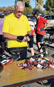 A Ride of Silence participant picks out a memorial wrist band.