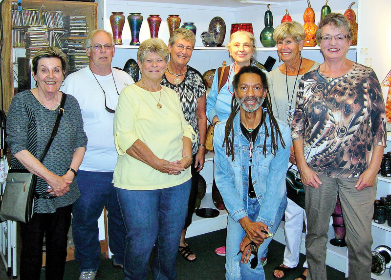 Study Group Leader John-Peter Wilhite (kneeling) along with Quail Creek/OLLI-UA Green Valley Campus Tucson Glass Art Scene class members and friends taking a moment at Tucson’s Philabaum Glass Gallery and Studio.