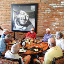 The Duke approves the strategy for the day while the Duffers enjoy breakfast.