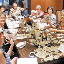 Left to right: After several hours of clipping and sorting coupons, Sheila Wyllie, Susan Simpson, Christy Caldwell, Kathi Krieg, Lois Connell, Gail Emery, Mary Beth Schmidt, Carolyn Walters, Lee Crombie and Janet Connell take a well deserved lunch break.