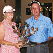 President Rose Welliver here with President Tom Bruno keeps the Prickly Pear Trophy!