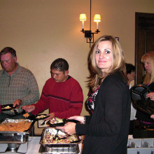 Employees from a previous year enjoy the event.