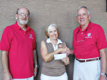 President of the Lady Putters Dee Waggoner presents donation check to Bob Atwater and Steve Abel from the Green Valley MOAA.