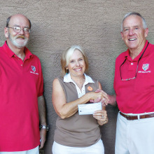 President of the Lady Putters Dee Waggoner presents donation check to Bob Atwater and Steve Abel from the Green Valley MOAA.