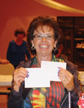 Volunteer Event: Volunteer and blackout game winner Christy Caldwell displays her winning cards.