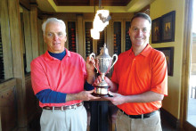 Quail Creek Golf Professional Joel Jaress presents 2014 Club Championship Trophy to Bob Ford.