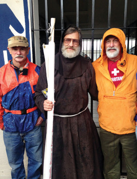 From left: Ricardo Osburn, monk and Steve Teichner. Ricardo and Steve are Democratic Club members.