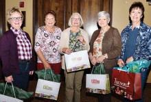 Door prize winners Diana Van Rossum, Marte Abel, Joan Hay, Kay Perkins and Dodie Prescott take home Tucson specialty products.