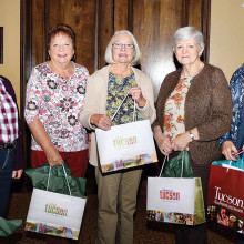 Door prize winners Diana Van Rossum, Marte Abel, Joan Hay, Kay Perkins and Dodie Prescott take home Tucson specialty products.