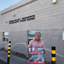 Harry Sawchuk proudly delivers part of the Canadian Club at Quail Creek donation to the Green Valley - Sahuarita Food Bank.
