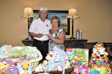 Ted Schelenski, Quail Creek Veterans Golf Association, presents a check for $500 to TWOQC Baby Shower Chair Pam Rodgers to help with the purchase of diapers and other baby necessities.