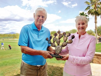 Tim Phillips, QCMGA Prickly Pair Tournament coordinator, with Bonnie Wilcox, representing the QCLGA, holding the about to be contested Prickly Pair Trophy.