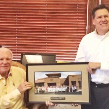Mr. Ed Robson (left) receives Creative Arts & Tech Center appreciation photo from Quail Creek POA Board member Jack Sarsam.
