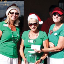 Left to right: Mary Anderson, Diane Dodd and Sylvia Perry took care of collecting cash and checks for the Christmas in July event; photo by Sylvia Butler.