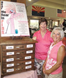 Gail Phillips and Cheri Sipe proudly show off the new Rally for the Cure Registration Chest of Drawers