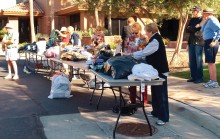 The Women of Quail Creek sort donations to benefit the homeless.