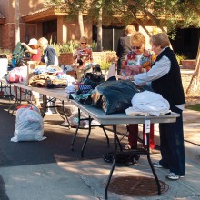 The Women of Quail Creek sort donations to benefit the homeless.