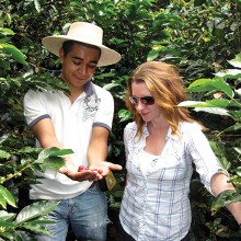Anna Perreira inspects the coffee crop with Lorving Calderon at Mi Tazita Coffee Farm in Honduras.