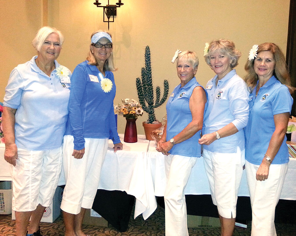 Left to right: Sporting daisies in their hair, Planning Committee members Jan Agner, Mary Anderson, Diane Dodd, Deb Anderson and Kelly Hines decorated tables with cacti and daisies; photo by Greg Freeland.