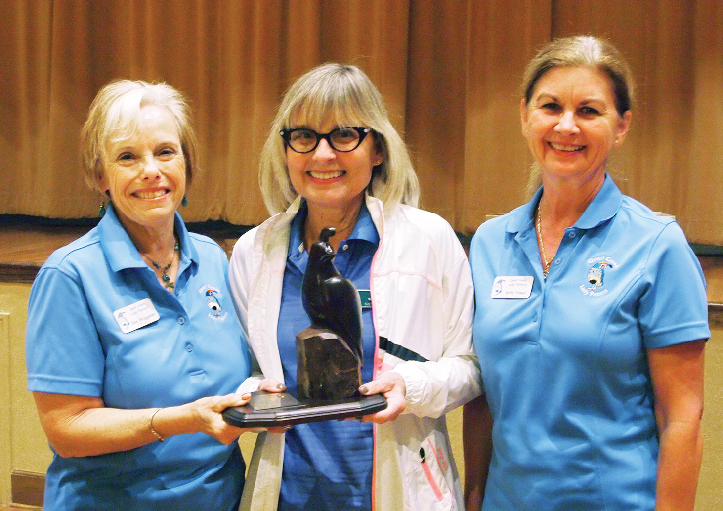 Left to right: Lou Moultrie is presented a plaque for achieving the lowest score from former Putters President Dee Waggoner and Kelly Hines, vice president; photo by Sylvia Butler.