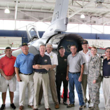 Members of Quail Creek’s Veterans Golf Association tour the F-16 pilot training facility at the Tucson International Airport.