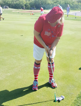 Lady Putter Suzan Bryceland went all out to show her love for the USA by wearing our national colors; photo by Peggy McGee