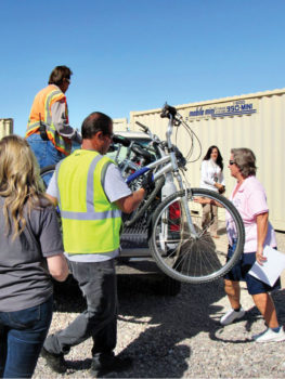 Bicycles being unloaded for donation; photo by Diane Quinn