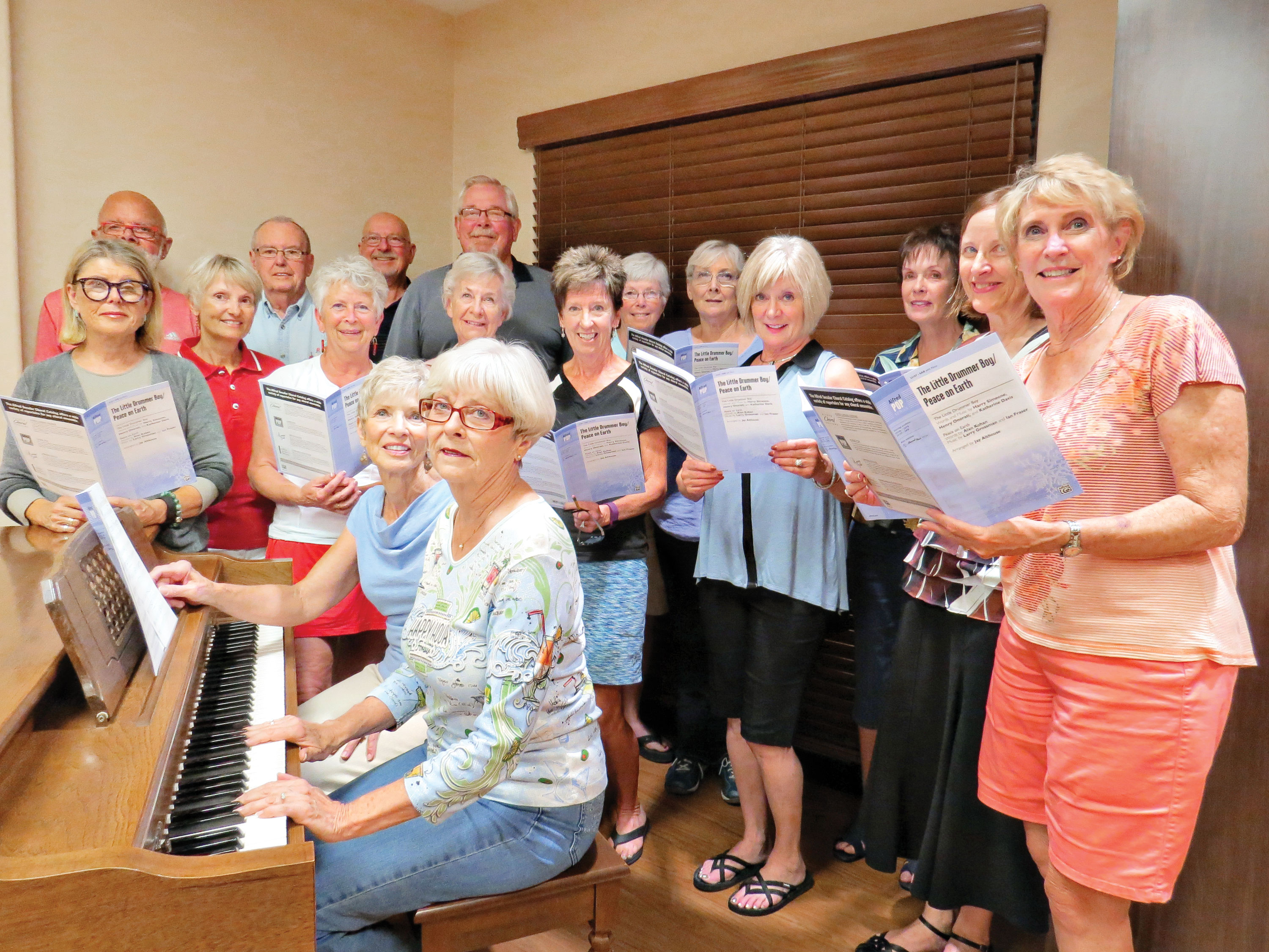 Some of the members of the Quail Creek Chorus rehearse numbers for the annual Performing Arts Guild’s Christmas Dinner Show, which runs December 1, 2 and 3; photo by Jeffrey Webster