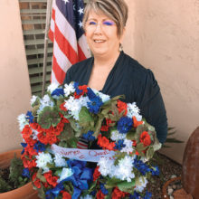 Carol Mutter prepares to attend Veterans Day Wreath Laying Ceremony; photo by Doug Mutter