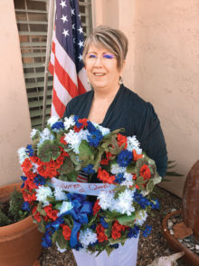 Carol Mutter prepares to attend Veterans Day Wreath Laying Ceremony; photo by Doug Mutter