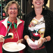 Laura Colbert and Christy Caldwell were among the volunteers at the HUD-VASH holiday celebration; photo by Peggy McGee.