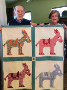 Gordon and Becky Gray with Gordon’s vintage quilt