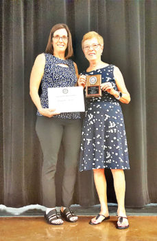 Congresswoman McSally presents a certificate to Colonel Peggy McGee who is holding the award plaque; photo by John McGee.