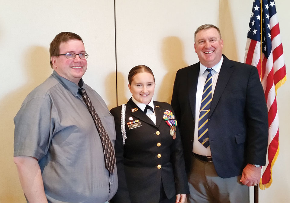 Left to right: Brian Hensley is all smiles upon learning that his daughter, Cadet Commander Kayla Hensley, Sahuarita High School Navy JROTC, was awarded a scholarship and Commander Brad Roberson, JROTC Advisor; photo by Betty Atwater.