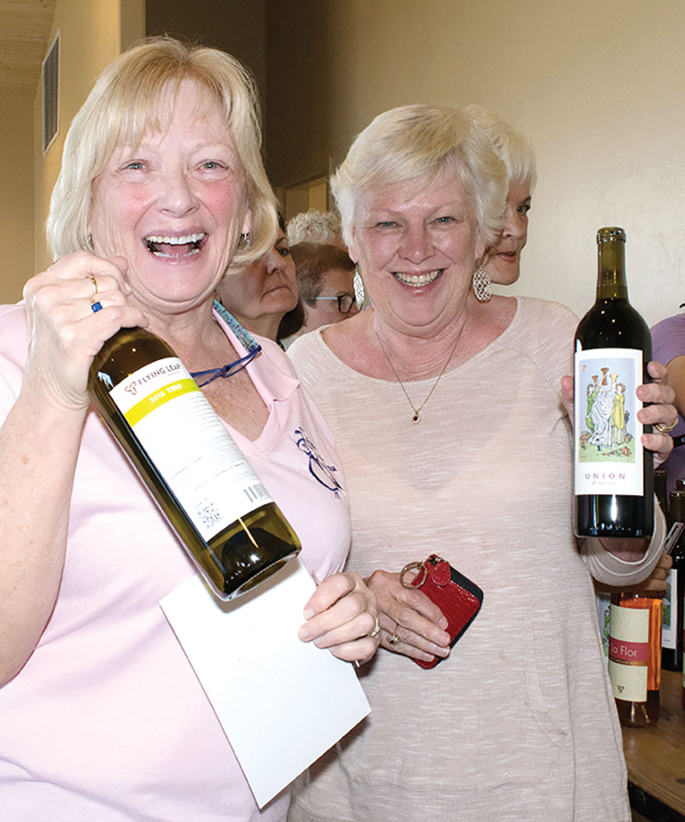 TWOQC members Nancy Trefethen and Caryl Reitinger take home souvenirs of the day’s outing.