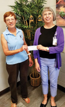 Left to right: Peggy McGee, on behalf of the Lady Putters, presented a check for $136 to Mary Jane Goodrick, Executive Director of Community Food Bank - Amado and Green Valley. This amount reflects the proceeds from the 50-50 raffle the Putters had in conjunction with its Moonlight Madness event. The raffle winner was Cathy Thiele, president of the Lady Putters; photo by Vicki Turner.