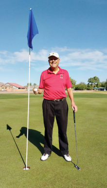 Ron Courson celebrates his hole-in-one during the Desert Duffer overnight golf outing to Casa Grande.