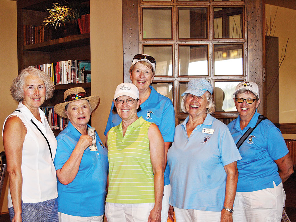 Left to right, front row: Chris Gould congratulates Frieda Hyles, Rose Welliver and Neila Kozel for getting two or more holes-on-one with Cathy Thiele also offering her congratulations; second row: Janet Wegner also got two holes-in-one; photo by Sylvia Butler