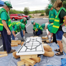 CERT members practice cribbing techniques to rescue a victim trapped under rubble. Photo by Peggy McGee
