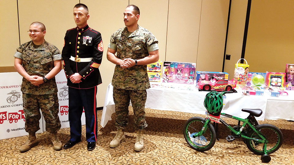 Marines from the Marine Corps Reserve Center in Tucson with some of the toys donated by members of Green Valley MOA; photo by John McGee