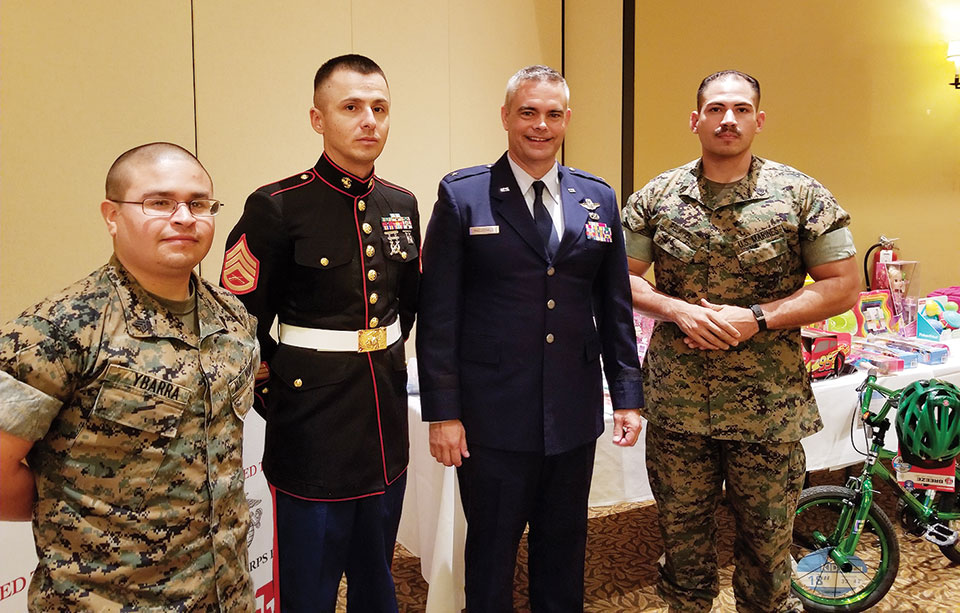 Marines from the Marine Corps Reserve Center in Tucson along with Air Force General MacDonald with some of the toys donated by members of Green Valley MOA; photo by Betty Atwater