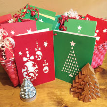 Members of TWOQC have created holiday cards which include a student name and information.