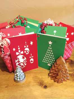 Members of TWOQC have created holiday cards which include a student name and information.
