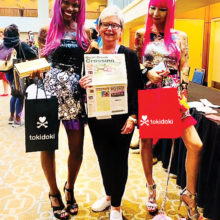 Diana VanRossum just couldn't resist the Barbie Convention photo-op. What a fun and colorful adventure!