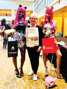 Diana VanRossum just couldn't resist the Barbie Convention photo-op. What a fun and colorful adventure!