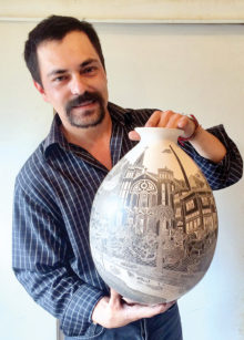 Hector Javier Martinez with one of his sgraffito pieces.
