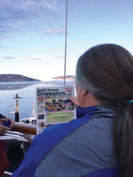 Quail Creek resident Terra was caught reading the Crossing in front of the Eqip Sermia Glacier in Western Greenland this summer while on a Road Scholar trip to Greenland and Iceland.