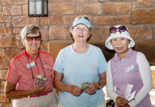 There was a three-way tie between Cathy Thiele (left), Cathy Leary, and Sung Whitehead, with each scoring three holes in one. They each went home with an extra $10 in their pockets. Photo by Jim Burkstrand.