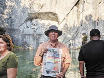 Jeff Prager reads the Crossing while visiting Lion Monument in Lucerne, Switzerland.