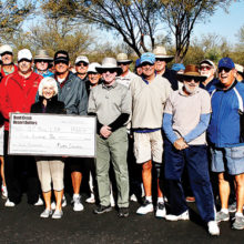 Several enthusiastic Quail Creek Desert Duffers were present to present Cheri Sipe, President of Quail Creek Nine Hole Ladies Golf Association, with a check for $500 from Duffers President Mike Senatra (blue sweater,) to help defray the cost of the Continental School District Junior Golf program sponsored by the Lady Niners.